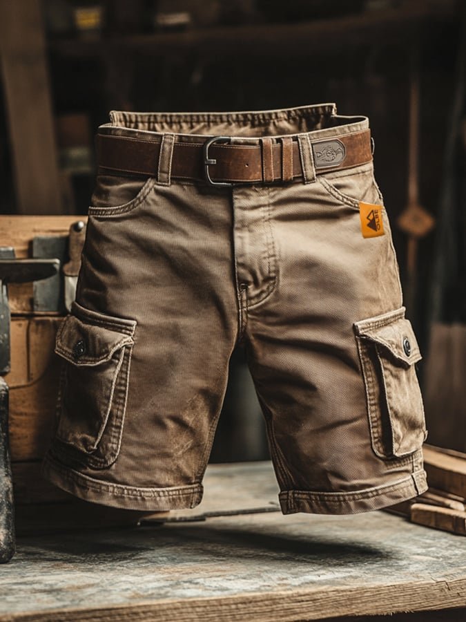 Close-up of rugged men's vintage cargo shorts showing durable fabric, reinforced stitching, and a utility pocket.
