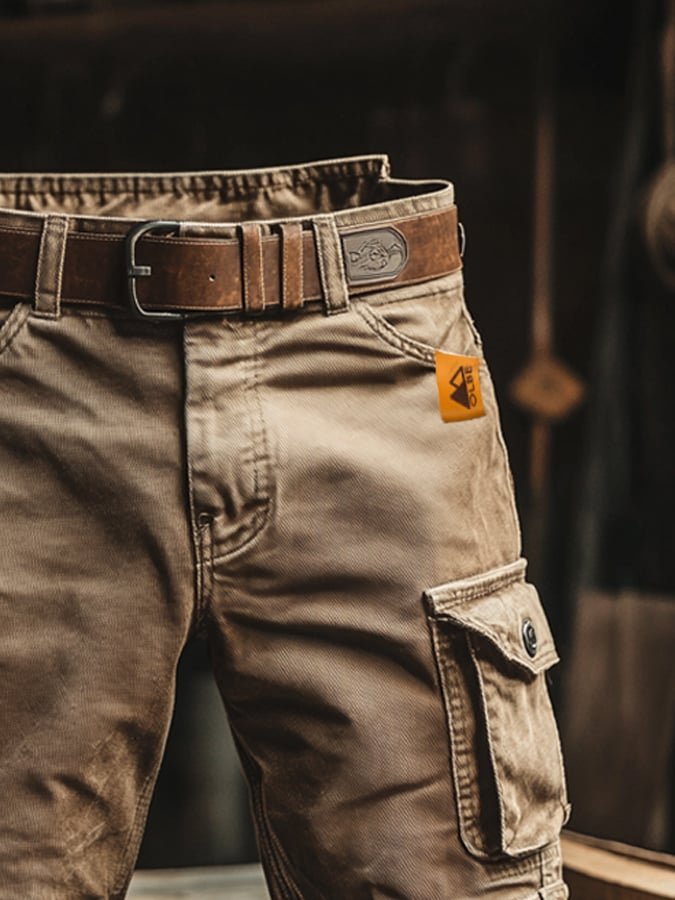 Side view of men's utility cargo shorts, featuring spacious pockets, relaxed fit, and vintage rugged aesthetic.