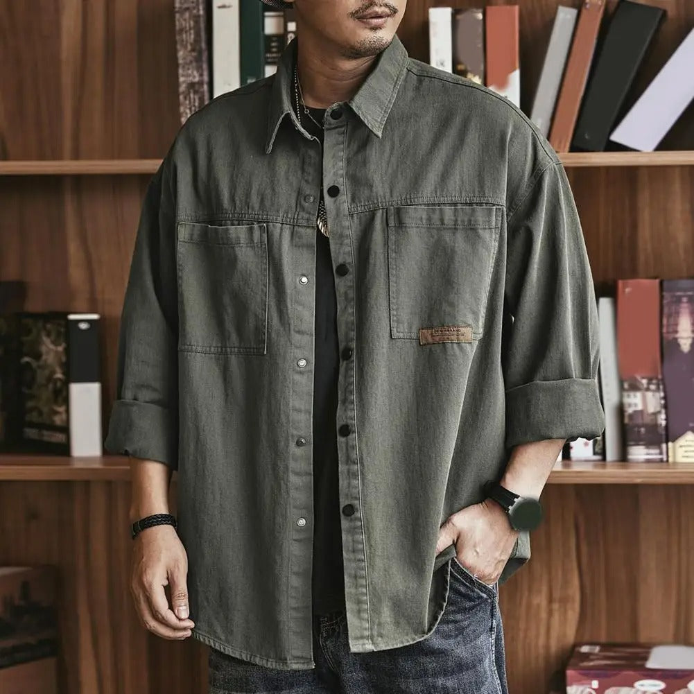 Men's relaxed fit vintage button-up shirt. Casual long sleeve for everyday wear, timeless retro style.