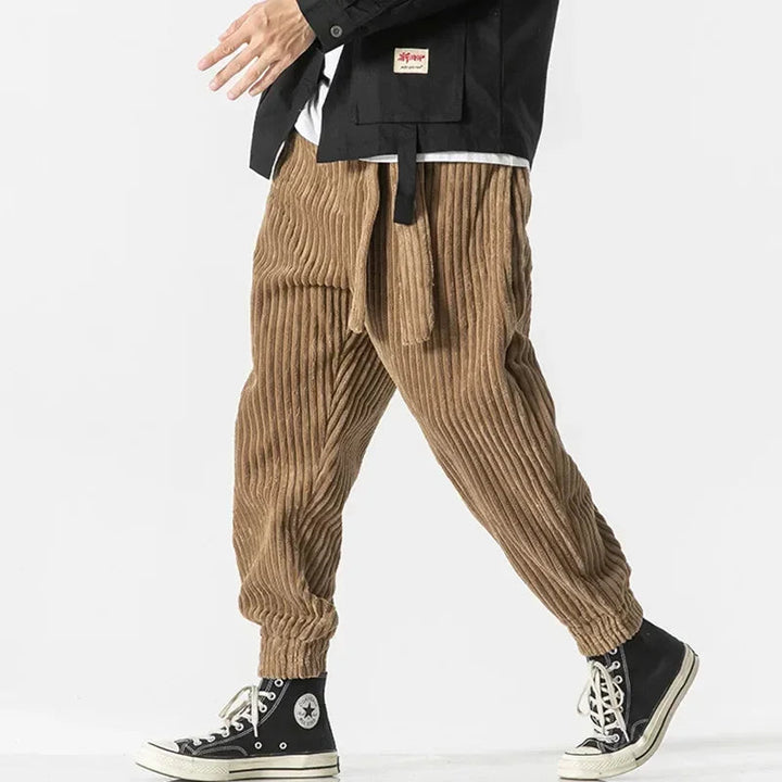 Men's vintage vibe relaxed fit jogger pants in khaki. Comfortable tapered loungewear with elastic waist.