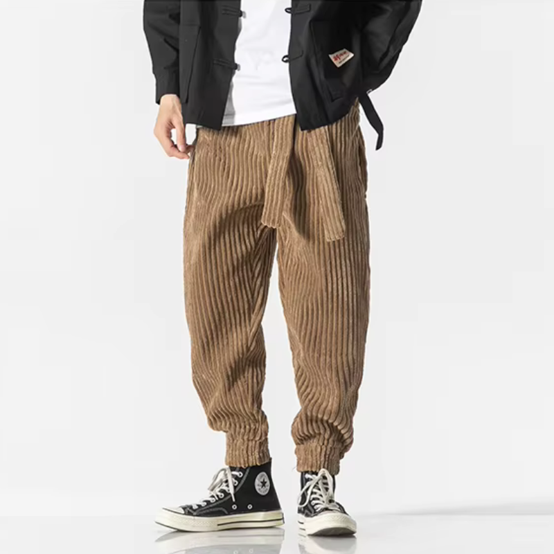 Black men's relaxed fit jogger pants. Tapered vintage style streetwear for comfortable casual everyday wear.