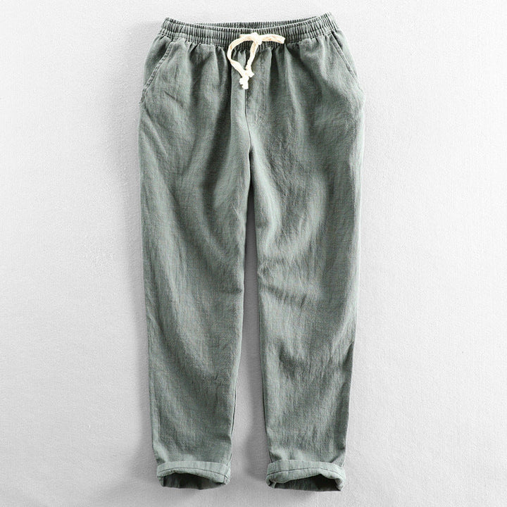 Lightweight men's linen trousers featuring a drawstring waist for ultimate summer comfort.