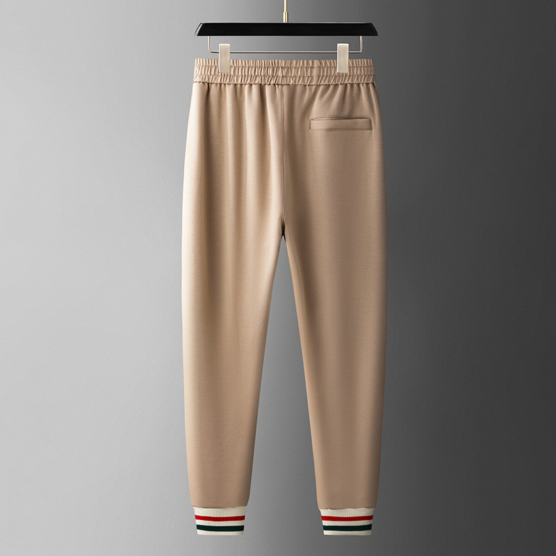 Modern men's full zip tracksuit, athletic jogger set for versatile sportswear.