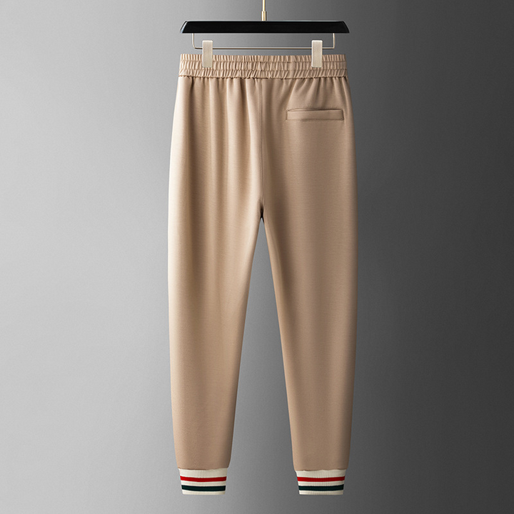 Modern men's full zip tracksuit, athletic jogger set for versatile sportswear.
