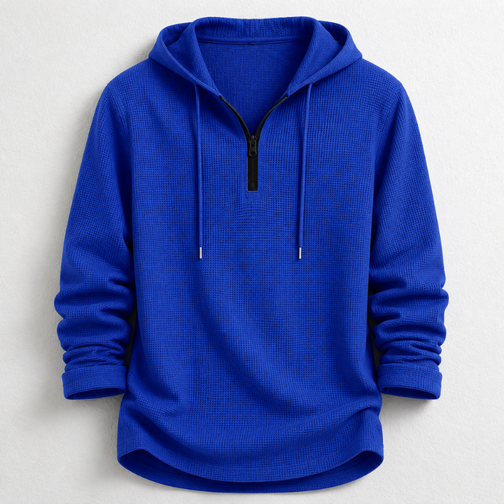 Stylish men's hooded henley shirt, quarter zip, features a soft waffle knit texture and long sleeves.