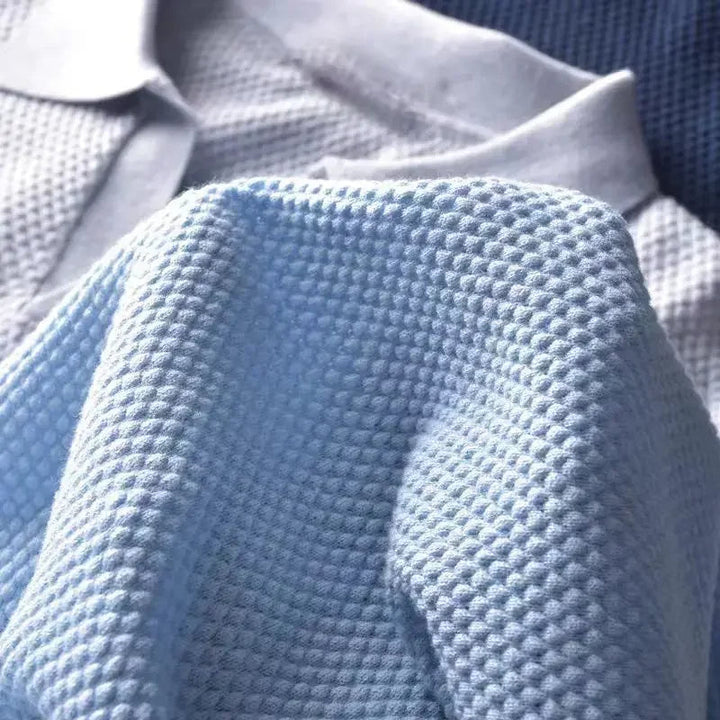 Stylish men's polo, breathable waffle knit, tailored fit for a smart look.