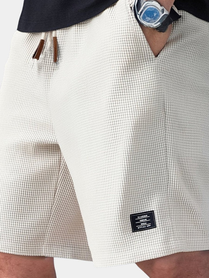 Men's waffle knit relaxed fit shorts. Comfortable, breathable, and perfect for casual summer wear & leisure.