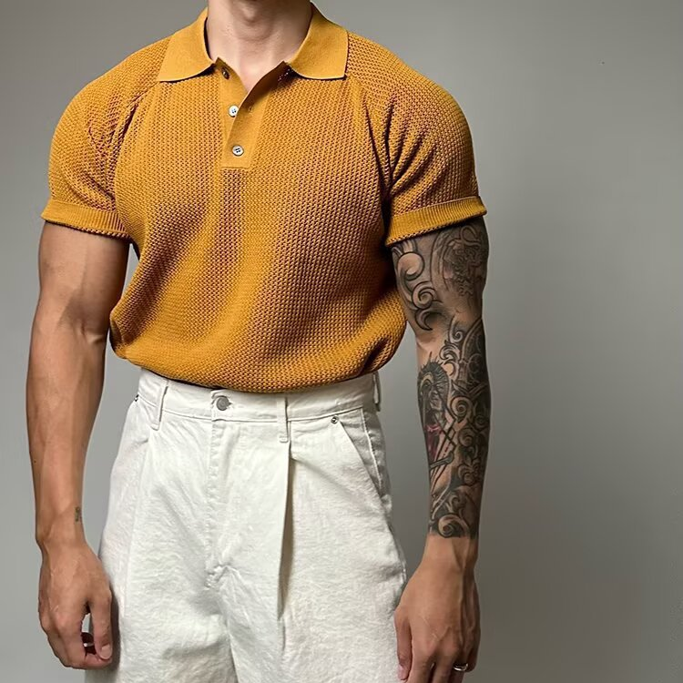 Men's waffle knit polo shirt displayed on a hanger. Short sleeve casual/smart casual fashion.