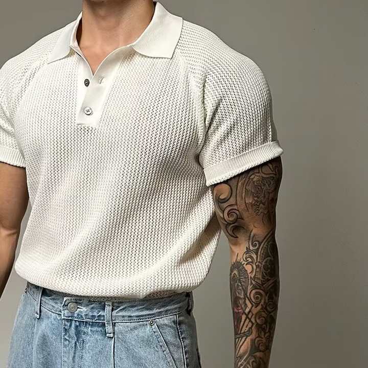 Versatile men's short sleeve polo with unique waffle texture. Classic button placket design.