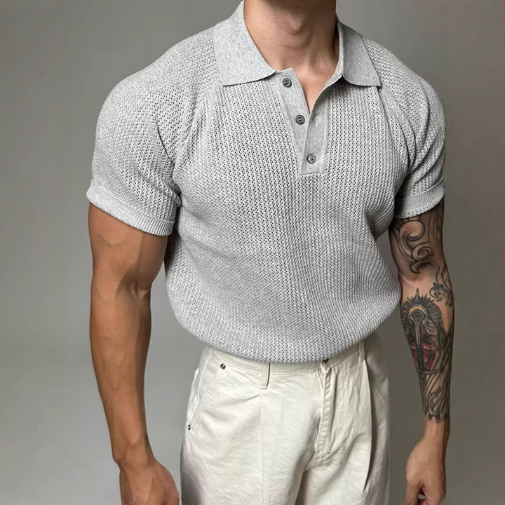 Men's fashion: short sleeve waffle polo with button placket. Comfortable textured everyday wear.
