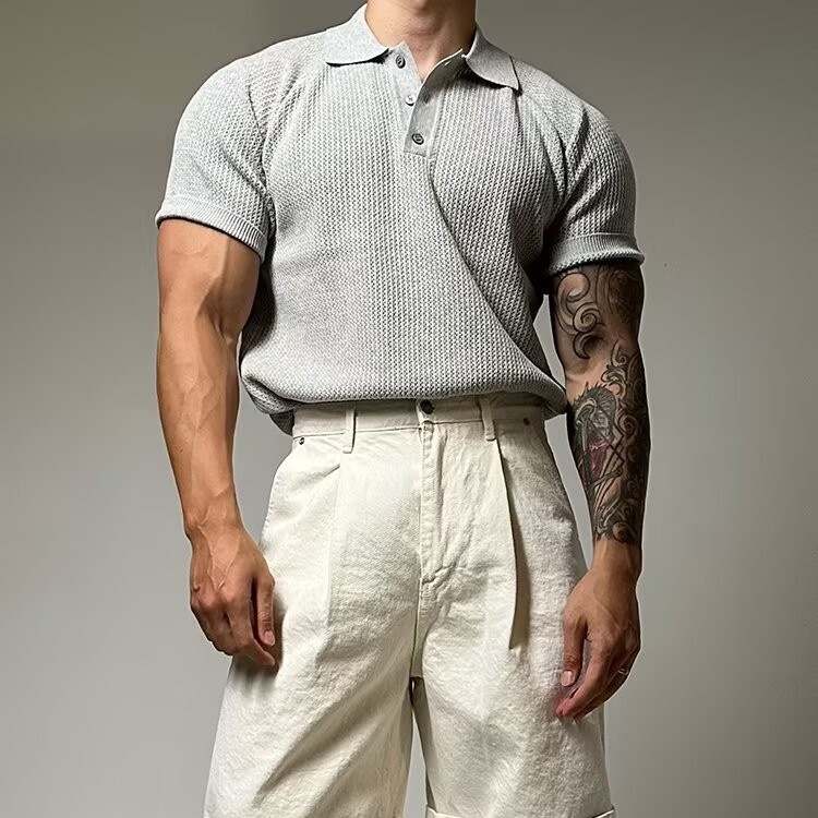 Casual men's waffle polo, featuring a classic button placket and breathable short sleeves.