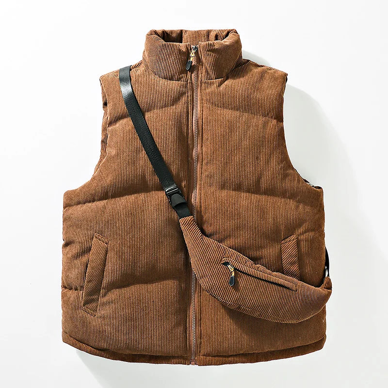 Men's warm alpine vest with integrated crossbody bag. Stylish winter outerwear & thermal layering piece.