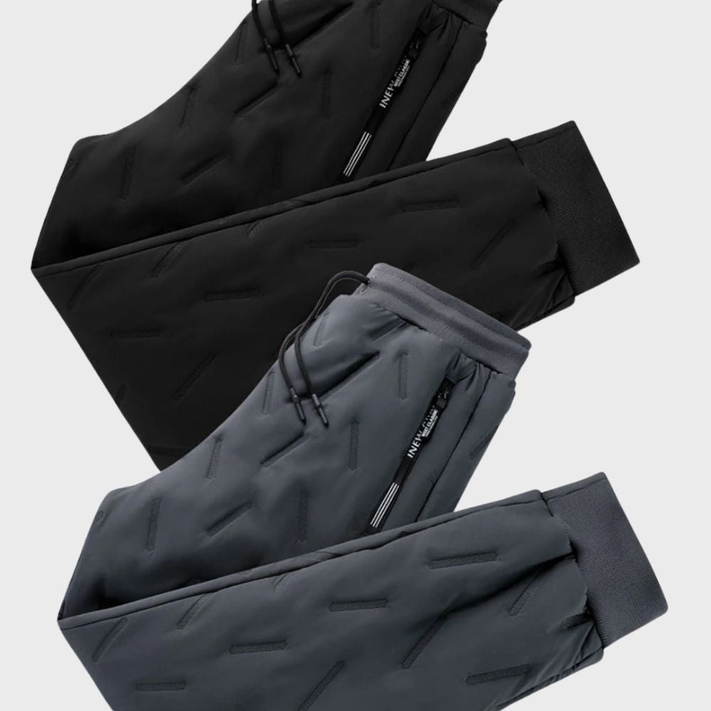 Black slim fit men's winter pants, warm and comfortable with a tapered leg for outdoor adventures.