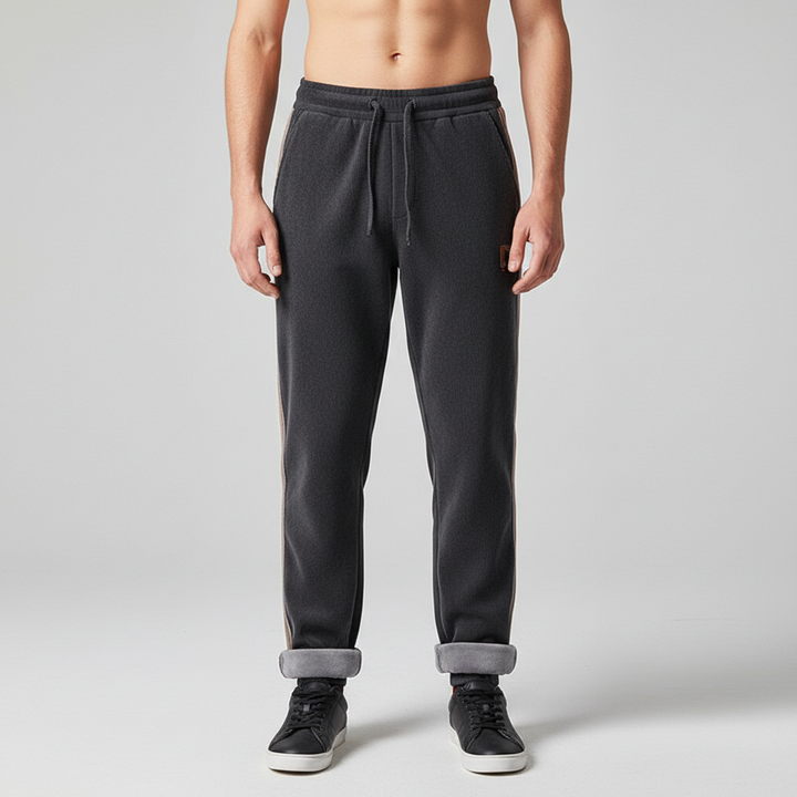 Stack of folded Men's Warm Jogger Trousers with fleece lining, highlighting comfort and winter readiness