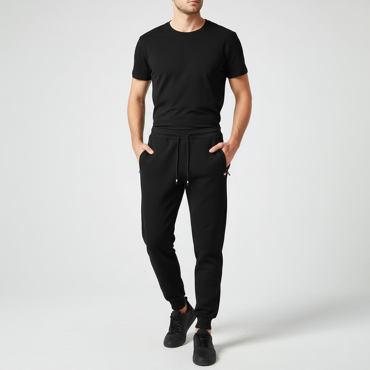 Side view of model in men's fleece lined sweatpants, highlighting the relaxed fit and comfort