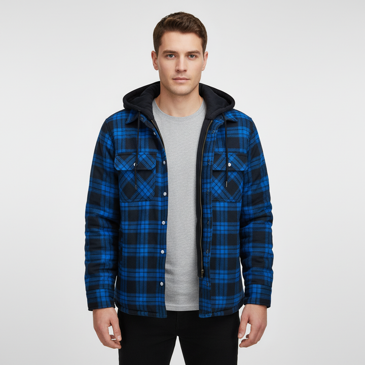 Close-up of fabric on men's warm plaid jacket, showing padded lining and button detail