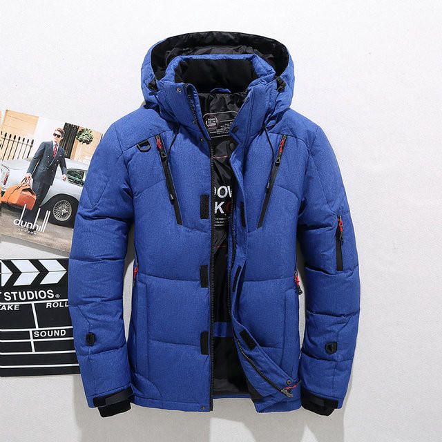 Men's warm insulated padded winter jacket with a removable hood.