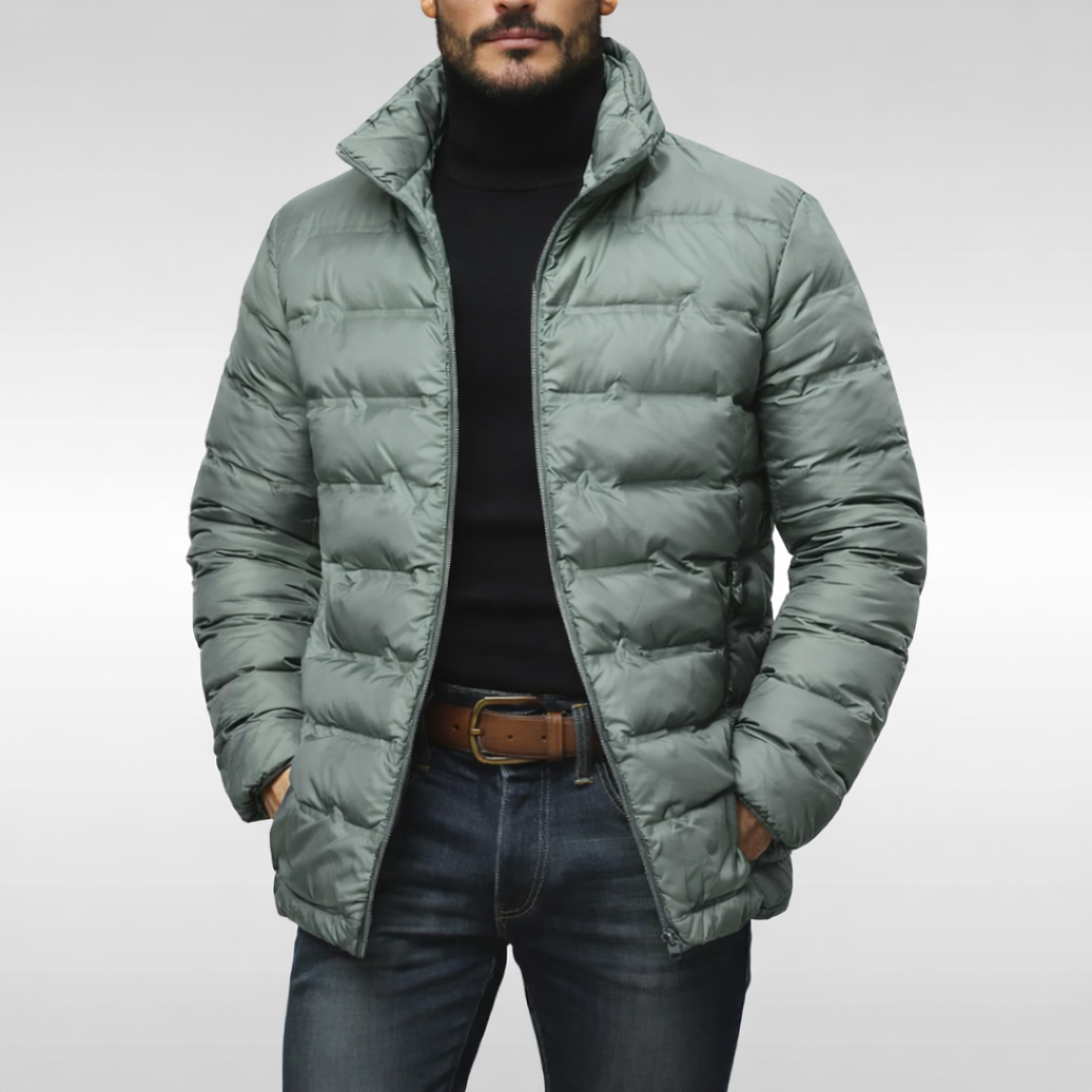 Man in a rugged insulated puffer jacket, ready for winter adventures. Warm men's outerwear.