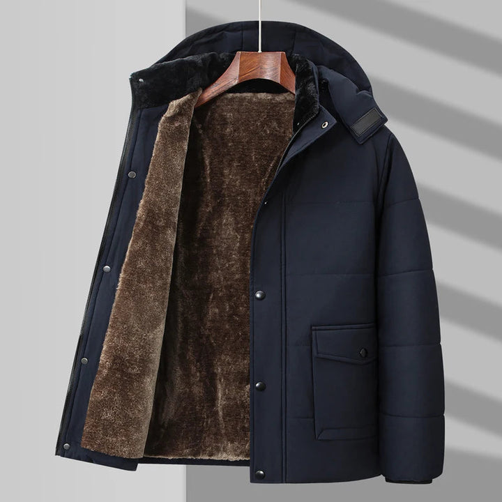 Stylish men's winter puffer jacket. Water-resistant outerwear with a cozy faux fur interior for warmth.