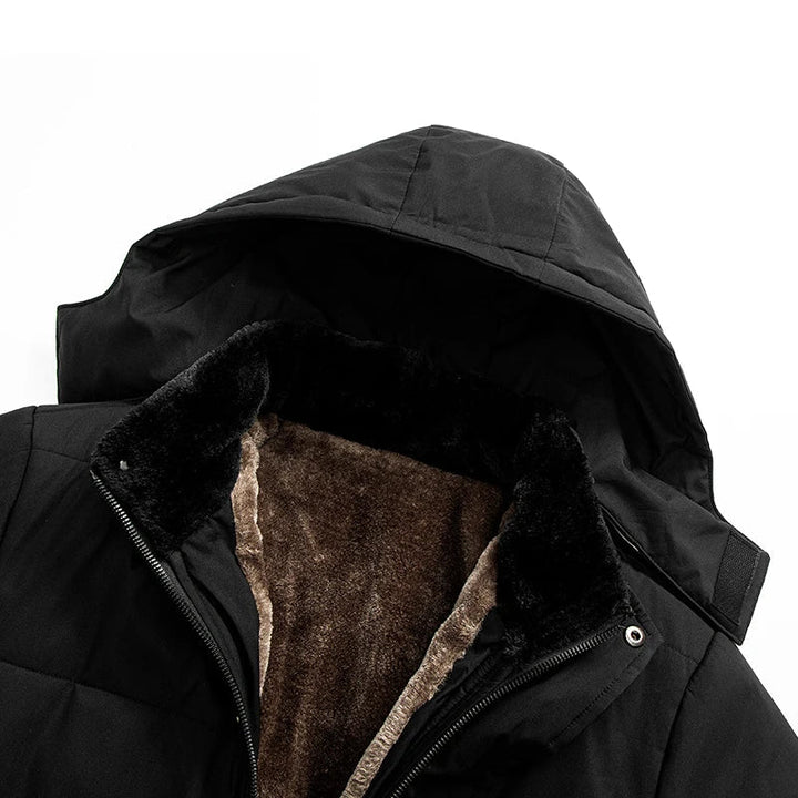 Elegant men's warm puffer jacket with faux fur hood detail. Ideal winter outerwear for cold, stylish protection.