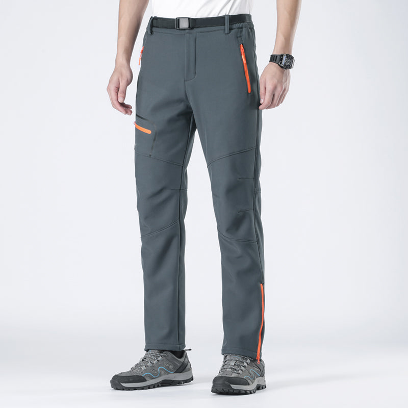 Versatile men's cold weather pants, waterproof & warm, perfect for travel & outdoor sports.