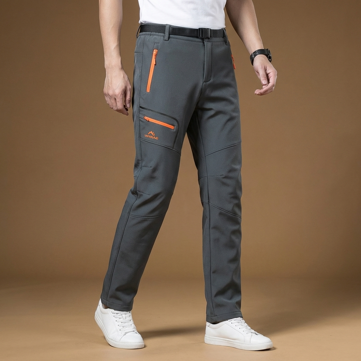 Durable men's waterproof & windproof outdoor winter pants for hiking & camping in cold.