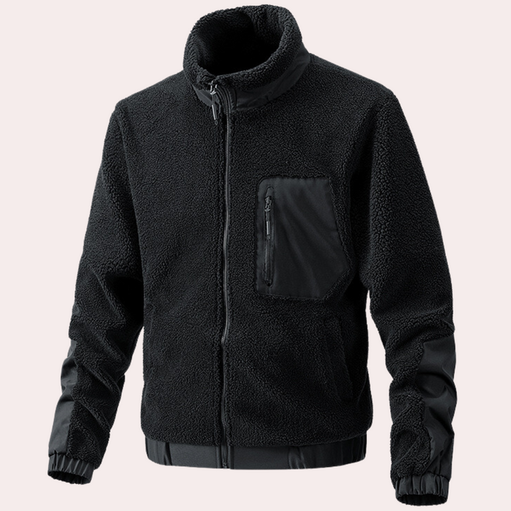 Close-up of durable fabric & secure zipper on a warm men's outdoor jacket. Ultimate cold weather comfort.