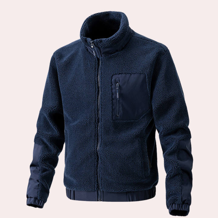 Stylish man wearing a versatile black men's outdoor jacket. Ideal casual outerwear for fall, winter & spring.