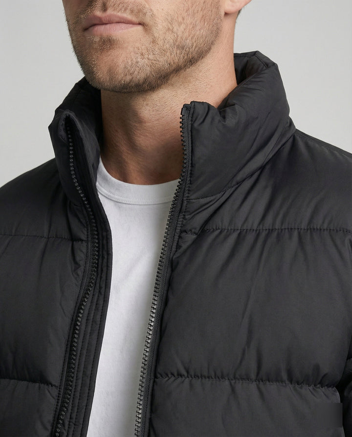 Men's insulated winter puffer jacket with hood, perfect for staying warm in cold weather.