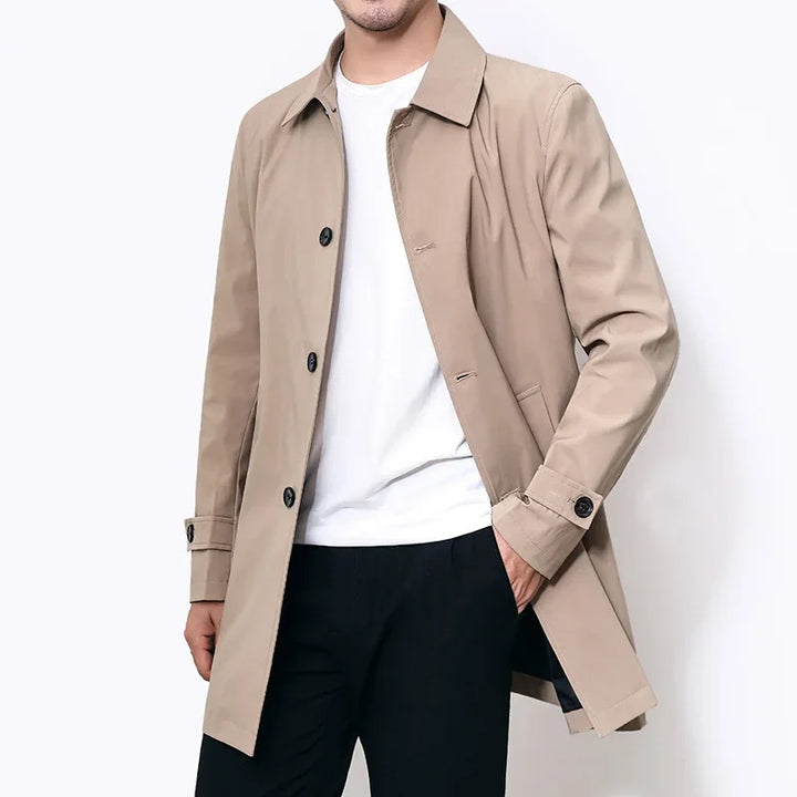 Stylish men's black water-repellent trench overcoat, perfect all-season outerwear for work, formal or casual outfits.