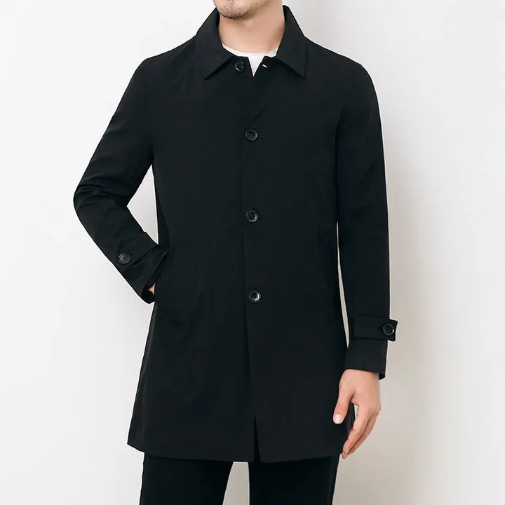 Men's water-repellent trench overcoat worn over a suit, ideal for formal workwear or smart casual all-season protection.