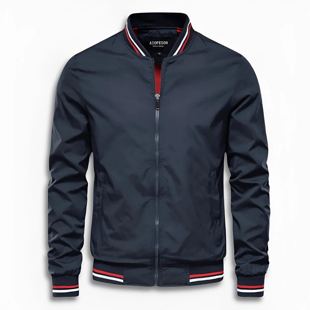 Close-up of men's water-repellent transition jacket's stand-up collar. High-quality fabric detail.