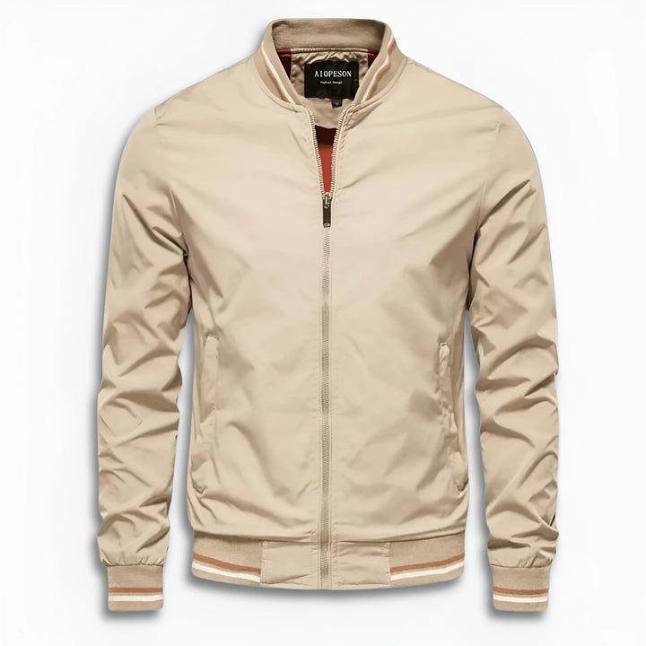 Full-body shot of a man wearing a water-repellent transition jacket with stand-up collar. Casual fit.