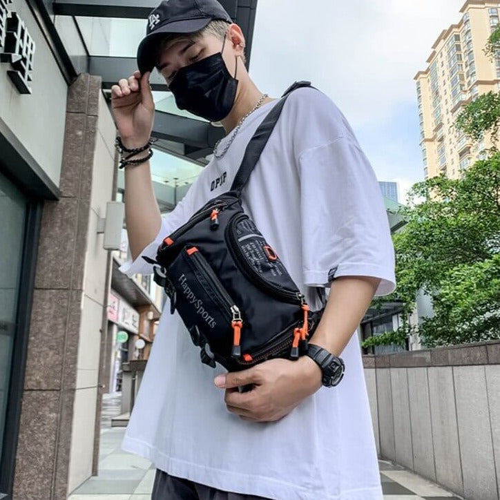 Versatile men's water-resistant multi-way bag, functions as sling, waist pack, or cross-body.