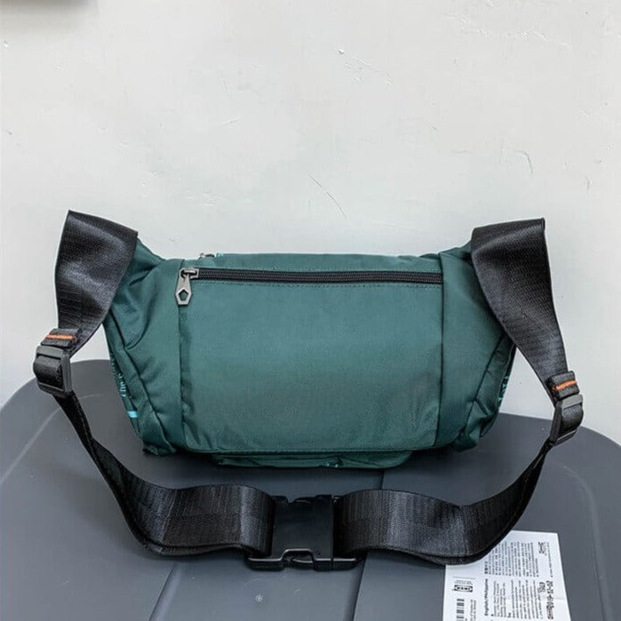 Men's water-resistant waist bag, offering secure storage for daily essentials on the go.