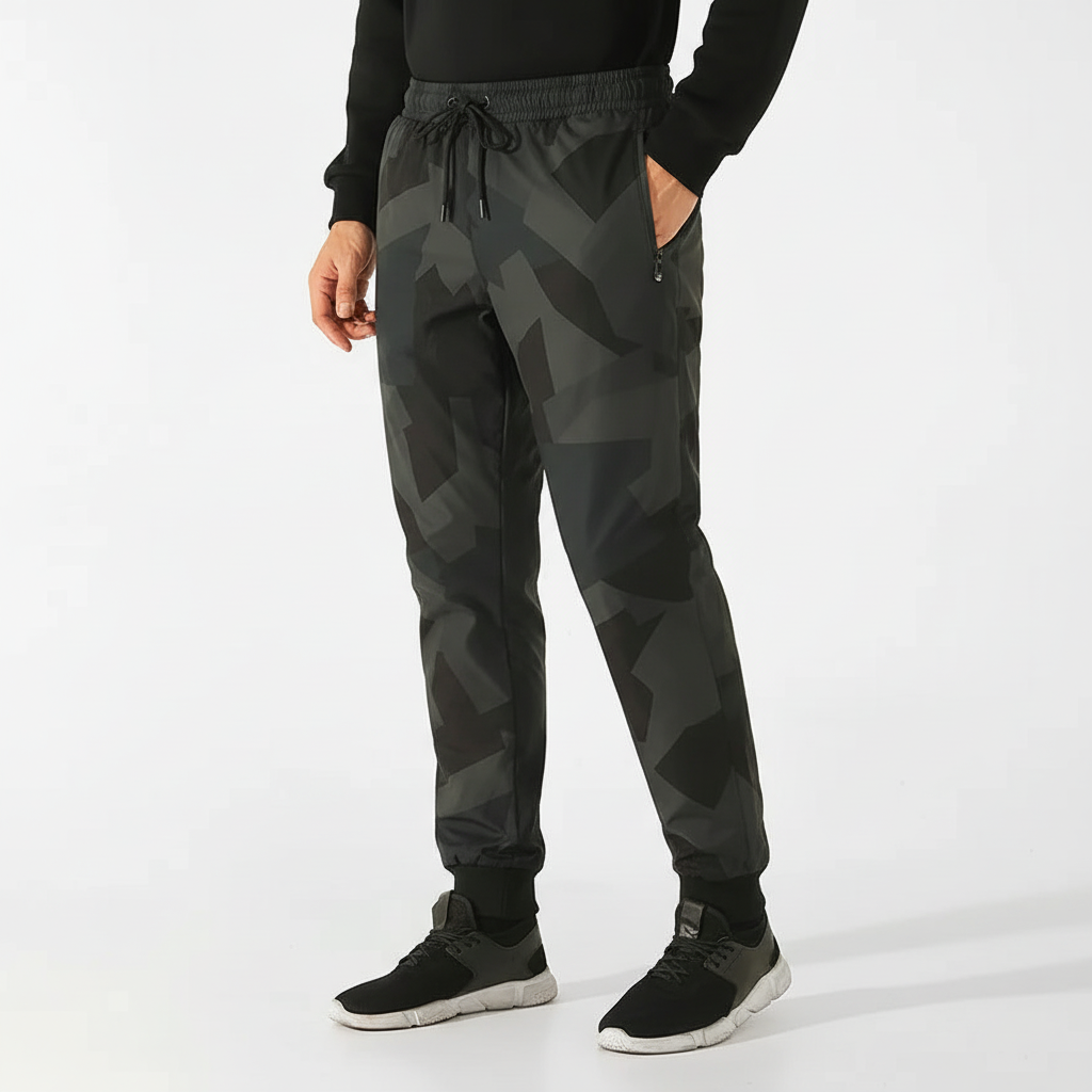 Men's waterproof down-filled joggers in Tarn Green, ideal for winter outdoor activities.