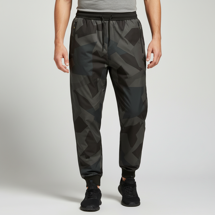 Men's black athletic waterproof pants with elastic waist and ankle cuffs.