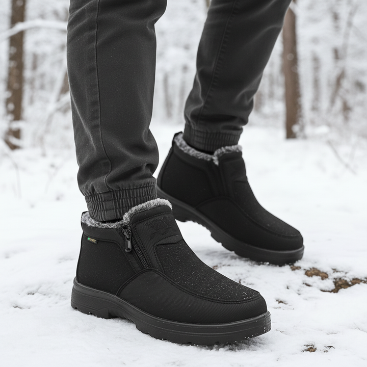 Pair of black men's insulated winter boots, waterproof, designed for cold