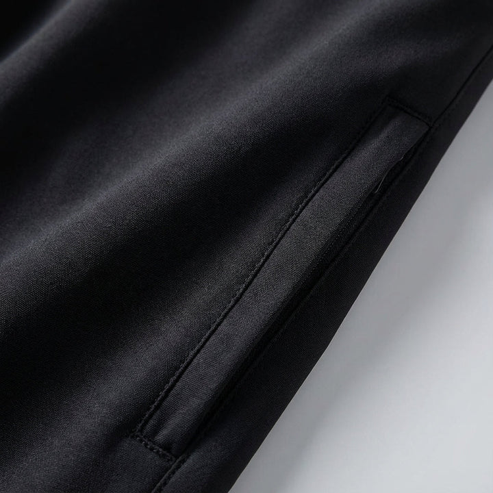 Close-up of the durable, stretch fabric on Rex men's waterproof hiking trousers, great for trekking.