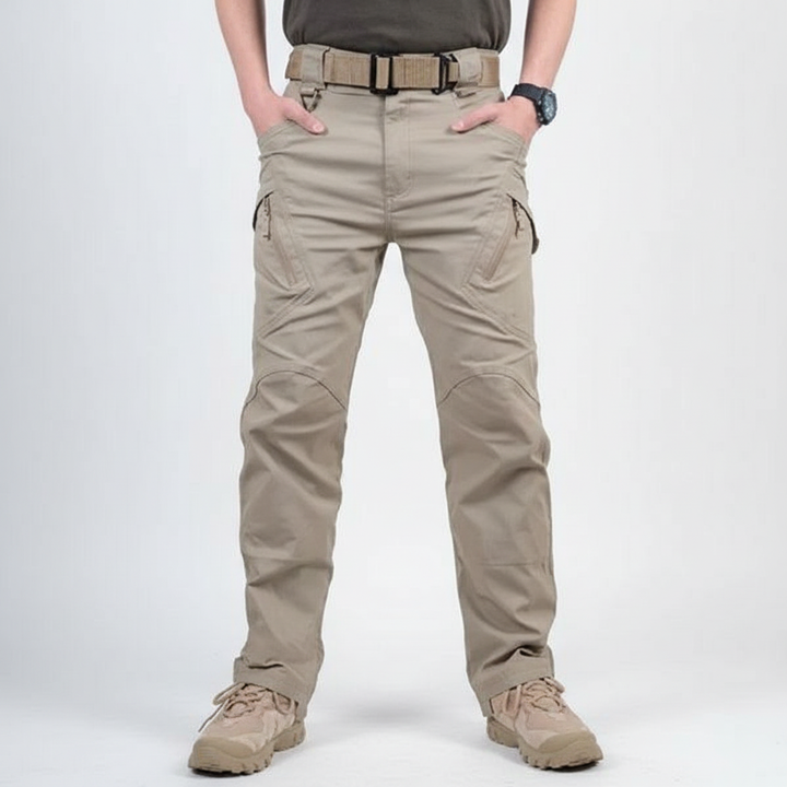 Sean men's hiking cargo pants in nature, showcasing waterproof and quick dry benefits