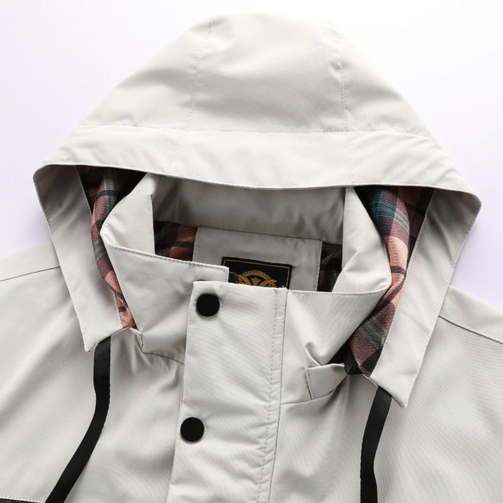 Sleek men's waterproof winter jacket. A stylish & warm cold-weather essential for outdoor comfort & dryness.