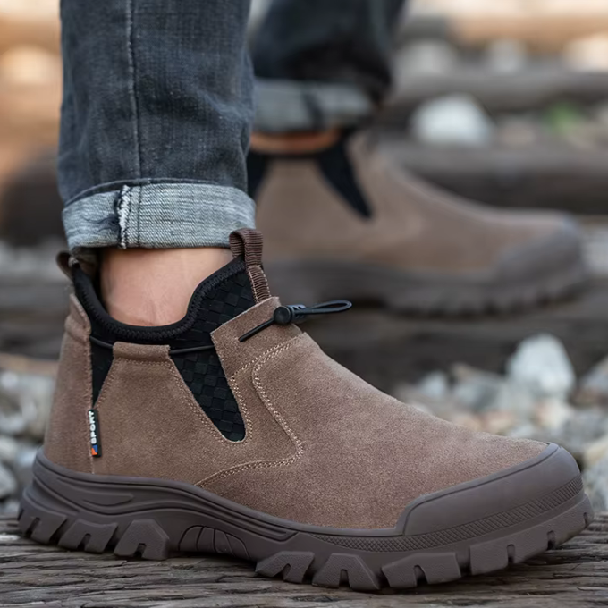 Side view of West Ridge men's brown steel-toe slip-on safety work boots, non-slip design.