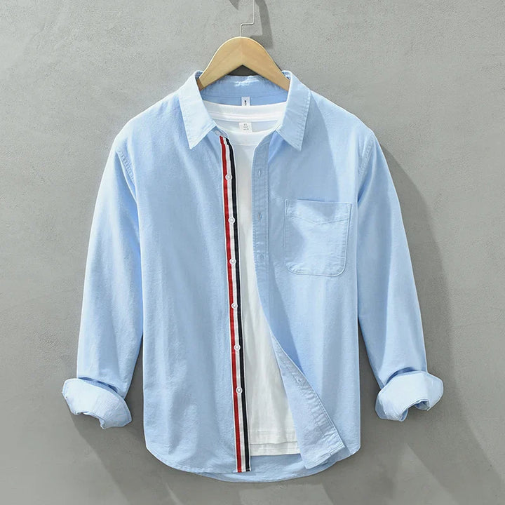 Stylish blue relaxed fit men's button-up shirt, perfect for effortless modern casual looks.