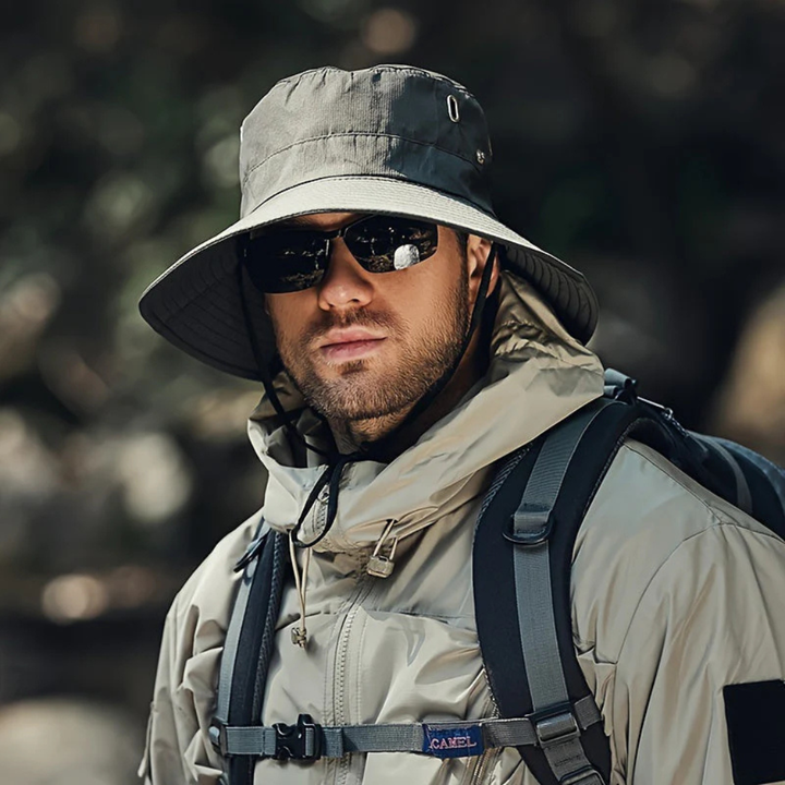 Lightweight men's outdoor sun hat, wide brim for ultimate UV protection, secure chin strap for travel.