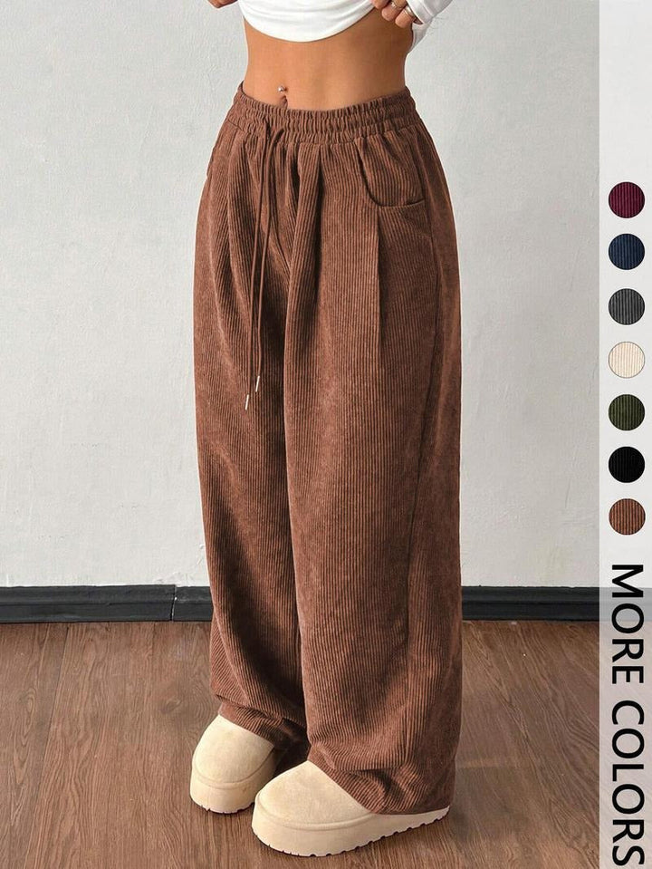 Men's wide-leg casual pants with a relaxed fit and stylish textured fabric.