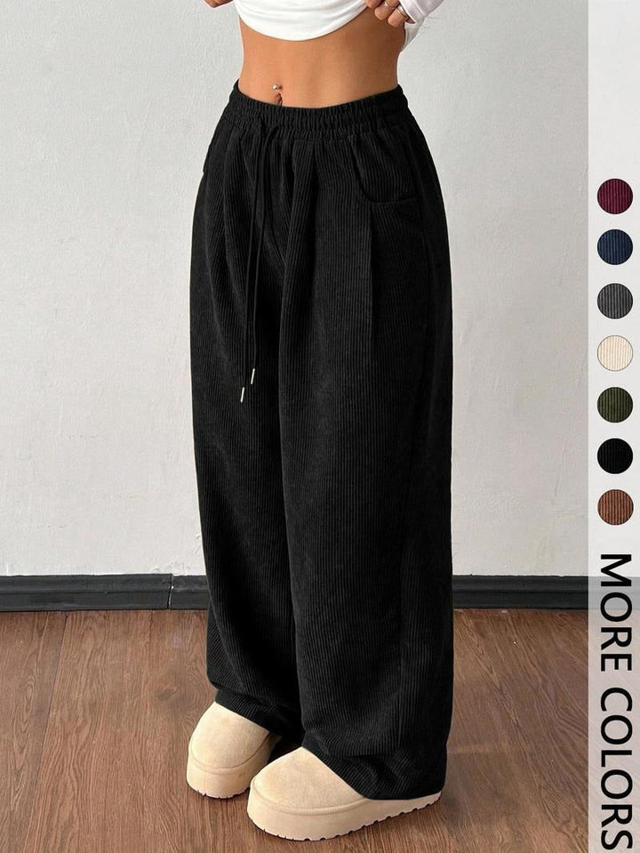Comfortable men's wide-leg drawstring pants, textured for relaxed everyday wear.