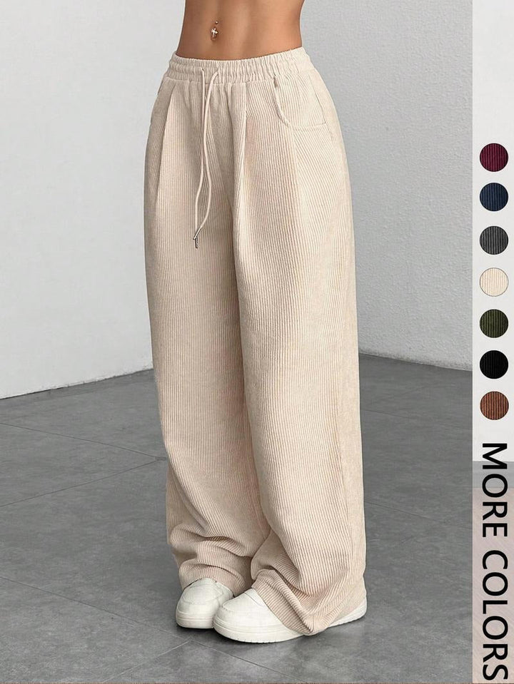 Relaxed fit men's textured wide-leg pants, ideal for comfortable casual and daily wear.