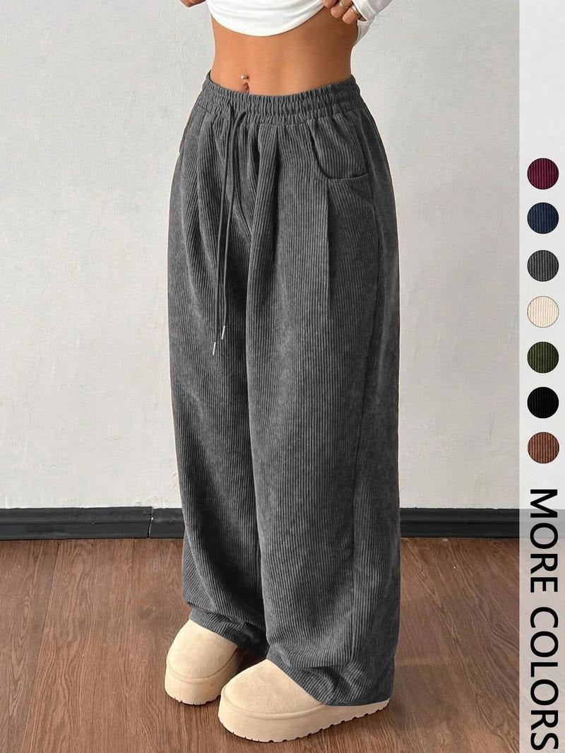Men's fashion wide-leg pants featuring a drawstring waist & unique textured fabric.