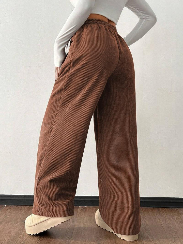 Versatile men's casual wide-leg pants with a soft textured feel and drawstring waist.
