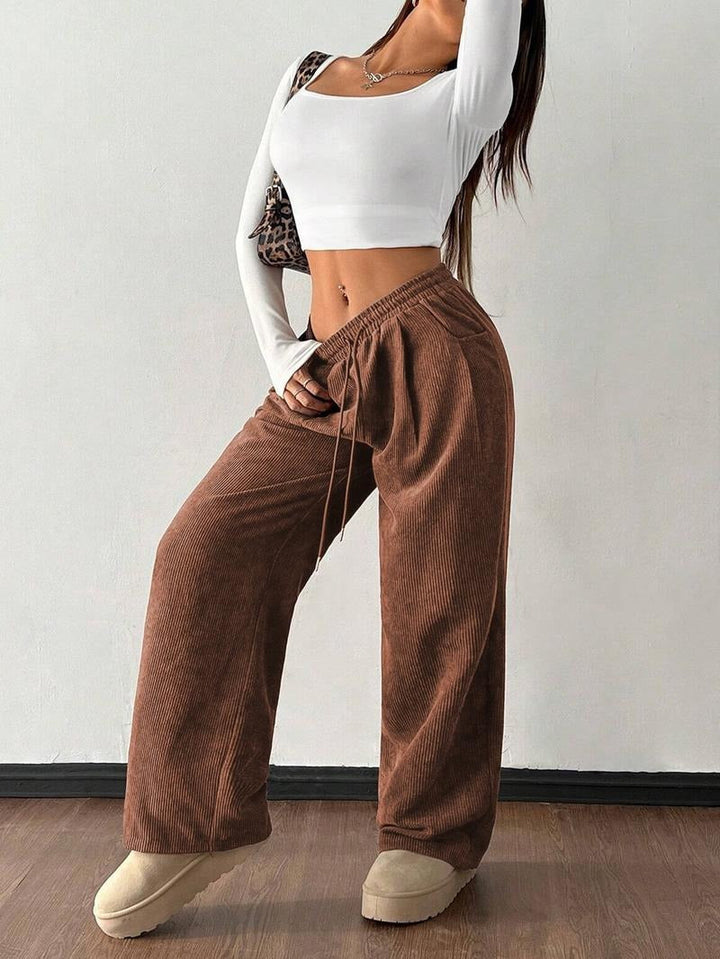Modern men's relaxed fit wide-leg textured pants, great for comfortable casual style.